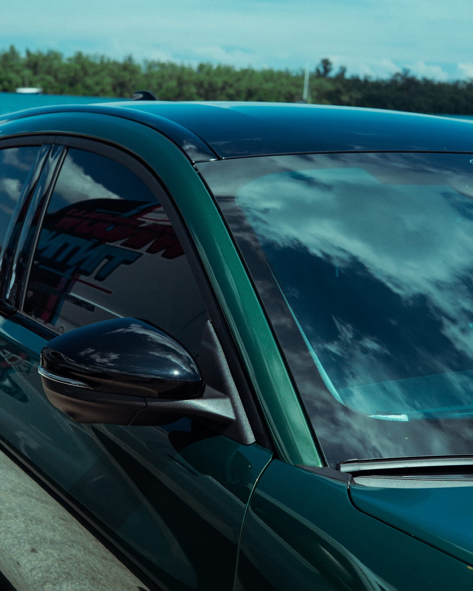 Close-up of a freshly tinted car window in the Miami sun