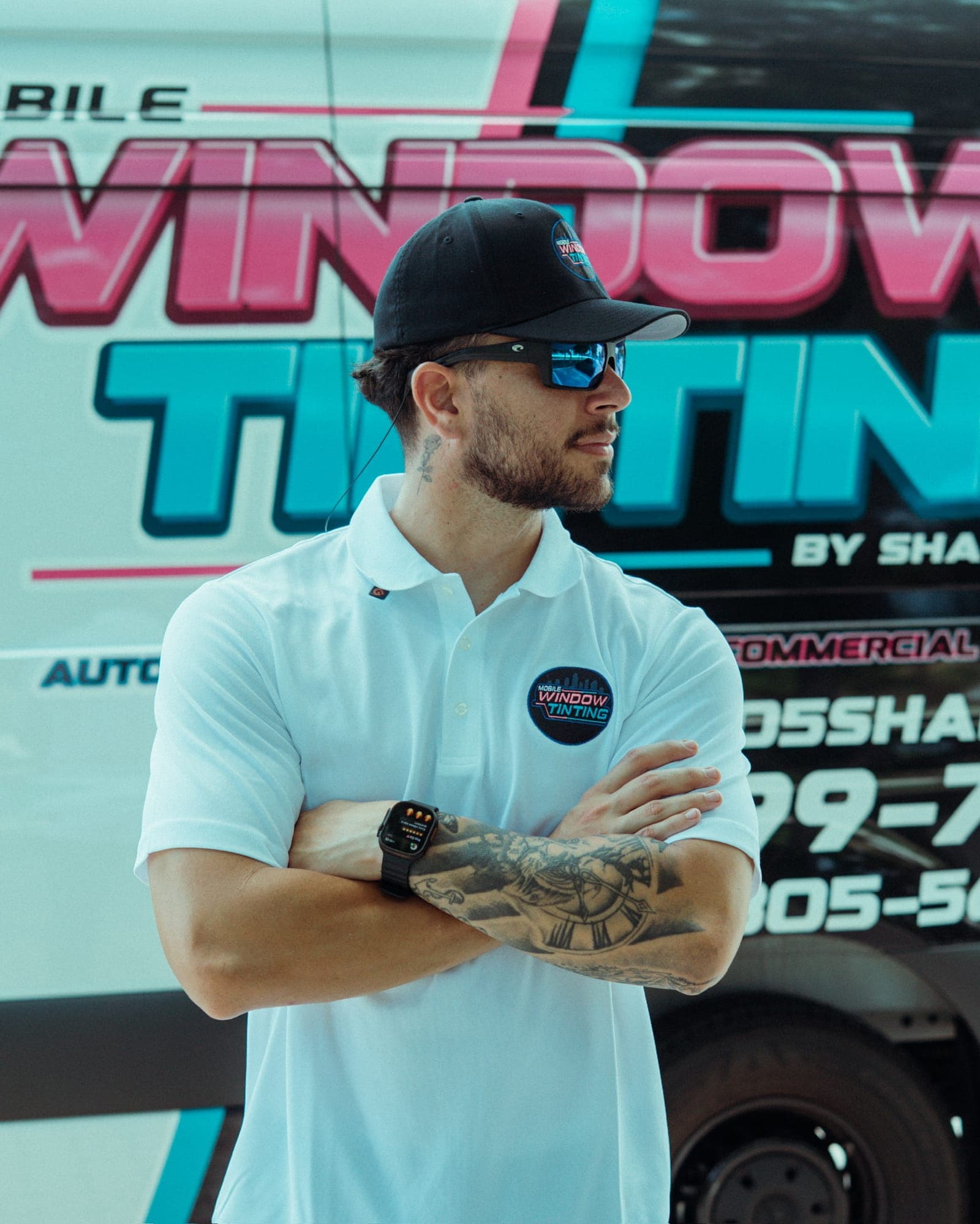ShadesPro technician in front of the branded mobile tinting van